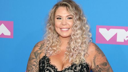 Teen Mom star Kailyn Lowry in a black top poses for a picture.